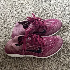 Nike Women's Flyknit Running Sneakers - Magenta/Pink with Black Swoosh